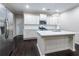 Modern kitchen features white cabinets, stainless steel appliances and a center island at 312 Overview Dr, Canton, GA 30114