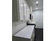 A bright white kitchen with stainless steel appliances and white subway tile backsplash offers a modern, clean aesthetic at 312 Overview Dr, Canton, GA 30114