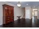 Open living room area with dark floors, and decorative wood furniture at 312 Overview Dr, Canton, GA 30114