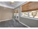 Bright sunroom with tiled floors, a ceiling fan, and windows overlooking the outdoors at 312 Overview Dr, Canton, GA 30114