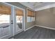 Bright sunroom with tiled floors, a ceiling fan, and windows overlooking the outdoors at 312 Overview Dr, Canton, GA 30114