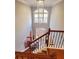 Grand two story foyer featuring a chandelier, wood staircase, and an elegant entryway at 505 Tilbury Dr, Suwanee, GA 30024