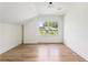 Bright bedroom with hardwood floors and natural light from a large window, offering a serene space at 1563 Westwood Sw Ave, Atlanta, GA 30310