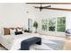 Bedroom featuring vaulted ceiling, large windows, neutral decor, hardwood floors and black ceiling fan at 1563 Westwood Sw Ave, Atlanta, GA 30310