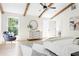 Bedroom with vaulted ceiling and beams, with plenty of natural light, neutral colors, and hardwood floors at 1563 Westwood Sw Ave, Atlanta, GA 30310