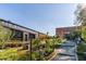 Exterior view of local businesses with a brick facade, landscaping, and a walkway at 1563 Westwood Sw Ave, Atlanta, GA 30310