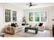 Living room filled with natural light, featuring a large sectional sofa and modern coffee table at 1563 Westwood Sw Ave, Atlanta, GA 30310