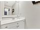 Bathroom with a white vanity, modern fixtures, and a bright mirror at 201 Beacon Cv, Canton, GA 30114