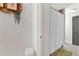 Bathroom with a white shower curtain, toilet and decorative hanging basket on the wall at 201 Beacon Cv, Canton, GA 30114