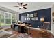 Bright home office with custom built-ins, a large window, and a statement wall with decor at 201 Beacon Cv, Canton, GA 30114