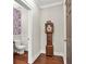 Charming powder room featuring a unique accent wall and a classic grandfather clock at 201 Beacon Cv, Canton, GA 30114