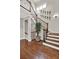 Staircase with hardwood floors and elegant railing system at 201 Beacon Cv, Canton, GA 30114