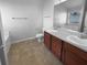 Bright bathroom featuring a double sink vanity and tiled floors at 2382 Capella Sw Cir, Atlanta, GA 30331