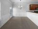 Cozy dining room featuring wainscoting and modern light fixture at 2382 Capella Sw Cir, Atlanta, GA 30331