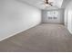 Large main bedroom featuring neutral walls, a fan and large closet space at 2382 Capella Sw Cir, Atlanta, GA 30331