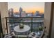 Balcony with city views, a small table, and comfortable seating to enjoy sunrise or sunset at 3445 Stratford Ne Rd # 2402, Atlanta, GA 30326