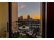 Cozy balcony with seating offers stunning city skyline views at sunset at 3445 Stratford Ne Rd # 2402, Atlanta, GA 30326