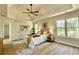 Bright bedroom featuring a ceiling fan, a large window, and neutral tones at 3850 Westwick Nw Way, Kennesaw, GA 30152