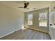 Bright, spacious bedroom with ample natural light and a ceiling fan at 3850 Westwick Nw Way, Kennesaw, GA 30152