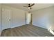 Spacious bedroom showcasing modern ceiling fan and two bright white closets at 3850 Westwick Nw Way, Kennesaw, GA 30152