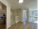 Upstairs hallway with hardwood floors and natural light at 3850 Westwick Nw Way, Kennesaw, GA 30152