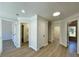 Hallway with multiple rooms and doors with consistent flooring at 3850 Westwick Nw Way, Kennesaw, GA 30152