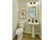 Stylish powder room with pedestal sink and modern fixtures at 3850 Westwick Nw Way, Kennesaw, GA 30152