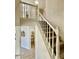 Carpeted staircase with white railing and ample natural light at 3850 Westwick Nw Way, Kennesaw, GA 30152