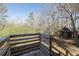 Wood deck overlooking a wooded backyard with a small shed at 3890 Irwin Bridge Nw Rd, Conyers, GA 30012