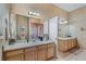 Bathroom featuring dual sinks, spacious countertop, and neutral wall color at 3890 Irwin Bridge Nw Rd, Conyers, GA 30012