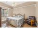 Bedroom featuring hardwood floors, ceiling fan, and window with blinds at 3890 Irwin Bridge Nw Rd, Conyers, GA 30012