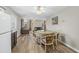 Open dining area with hardwood floors, chandelier, and natural light, connecting the kitchen to the living space at 3890 Irwin Bridge Nw Rd, Conyers, GA 30012