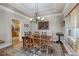 Elegant dining room with hardwood floors, tray ceiling and vintage chandelier at 3890 Irwin Bridge Nw Rd, Conyers, GA 30012