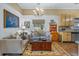 Charming living room with a view of the kitchen area featuring natural light from the window at 3890 Irwin Bridge Nw Rd, Conyers, GA 30012