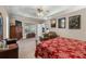 Relaxing main bedroom suite with plush carpet, a large window, ceiling fan, and ample space for a sitting area at 3890 Irwin Bridge Nw Rd, Conyers, GA 30012