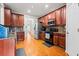 Well-lit kitchen featuring granite countertops, stainless steel appliances, and ample cabinet space at 4526 Warren Mill Trl, Ellenwood, GA 30294