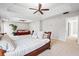 Bright main bedroom with seating, complemented by a cozy sitting area, and carpet flooring at 4526 Warren Mill Trl, Ellenwood, GA 30294