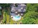 Aerial view showcasing the home's sprawling lot, private pool, and lush surrounding greenery at 1230 Mars Hill Nw Rd, Acworth, GA 30101