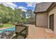 Expansive wooden deck overlooking a private backyard with a sparkling pool at 1230 Mars Hill Nw Rd, Acworth, GA 30101