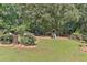 Manicured backyard featuring a playground, trampoline, and rose garden at 1230 Mars Hill Nw Rd, Acworth, GA 30101