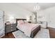 Bedroom with a chandelier, a soft area rug, and a dark-wood frame bed at 1717 N Decatur Ne Rd # 322, Atlanta, GA 30307