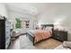 Charming bedroom featuring a chandelier, hardwood floors, and cozy furniture at 1717 N Decatur Ne Rd # 322, Atlanta, GA 30307