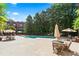 Community pool area with lounge chairs, umbrellas, and inviting blue water at 1717 N Decatur Ne Rd # 322, Atlanta, GA 30307