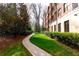 Picturesque walking path and building exterior with manicured landscaping at 1717 N Decatur Ne Rd # 322, Atlanta, GA 30307