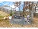 Backyard hangout area with a swing and seating made of Adirondack chairs at 213 Augusta Walk, Canton, GA 30114