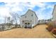 Wide view of the back of the home with a large, grassy backyard at 213 Augusta Walk, Canton, GA 30114