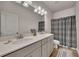 Bathroom featuring a double sink vanity, modern fixtures, and a shower-tub combo at 213 Augusta Walk, Canton, GA 30114