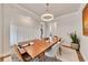 Elegant dining room with wainscoting, modern lighting, and a neutral color palette for entertaining at 213 Augusta Walk, Canton, GA 30114