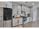 Bright kitchen featuring modern appliances, sleek cabinetry, and durable countertops at 213 Augusta Walk, Canton, GA 30114