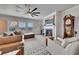 Bright living room with a fireplace, large windows, and comfortable seating for relaxation at 213 Augusta Walk, Canton, GA 30114